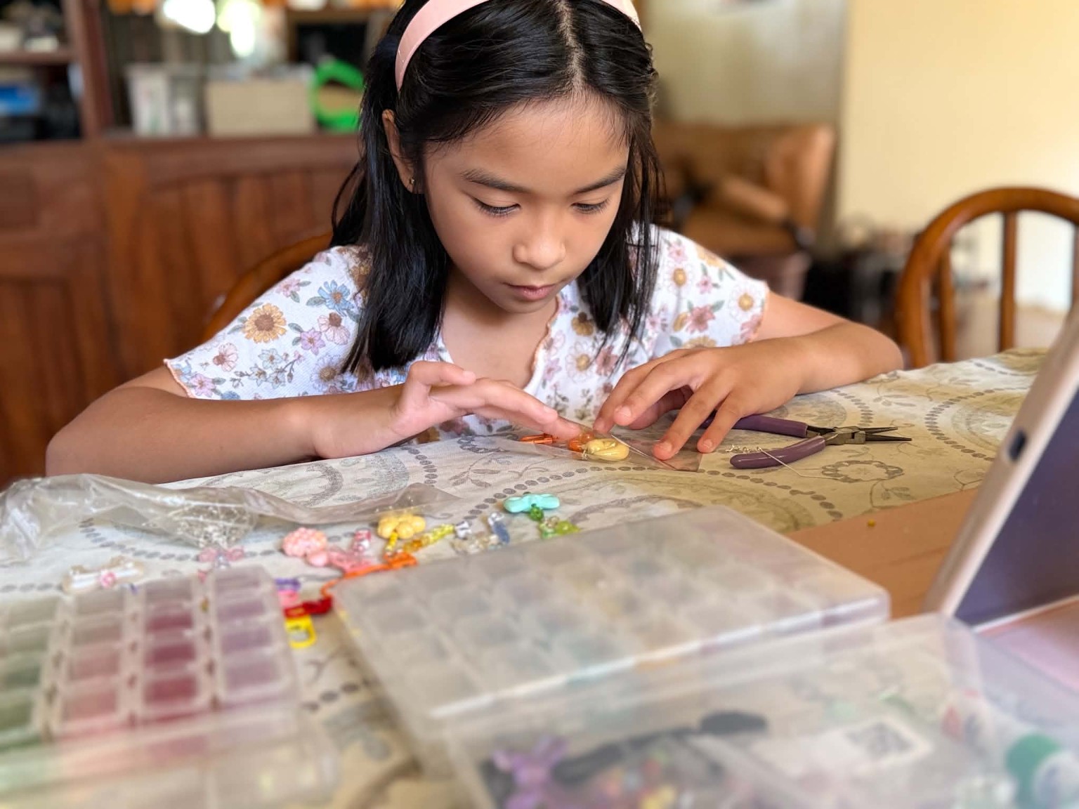 Denise crafting a handmade keychain